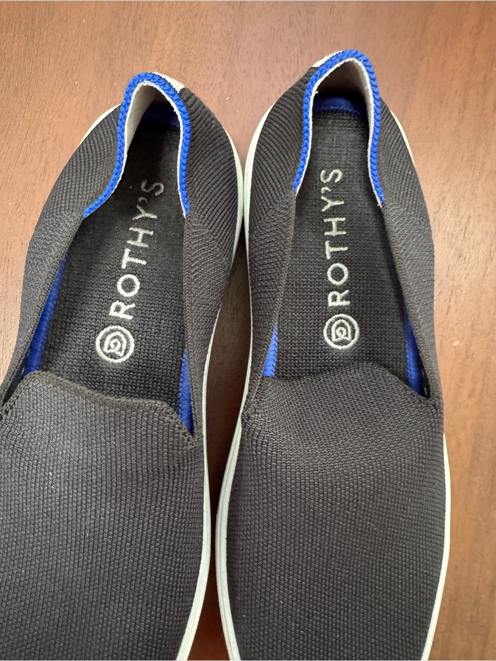 Rothy's Womens Black Slip-On Sneakers with Blue Trim